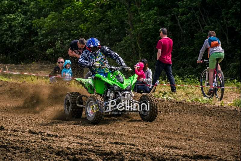 ATV Rider accelerating in dirt track. TransCarpathian regional Motocross Championship