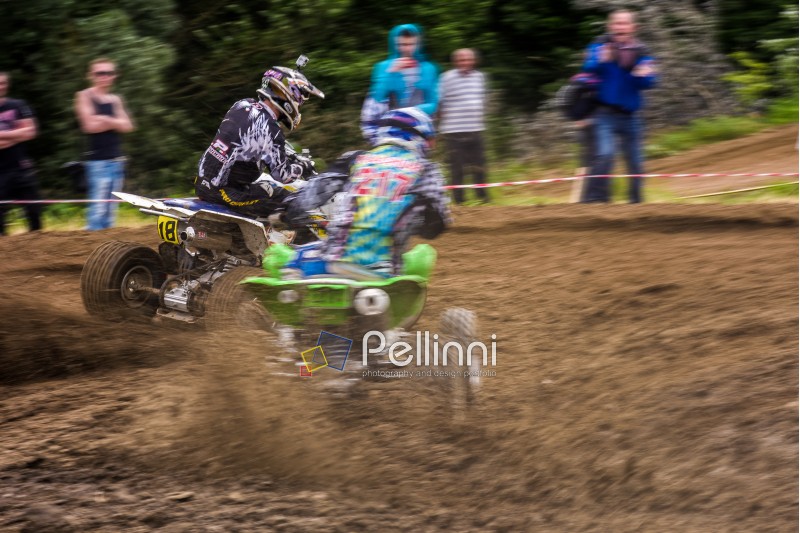 ATV Rider in the action. Off-road extreme cornering in dust. TransCarpathian regional Motocross Championship