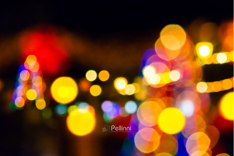 abstract composite of Christmas street lights at night