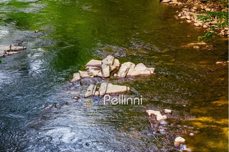 colorful surface of the forest river. natural background with stone and water textures