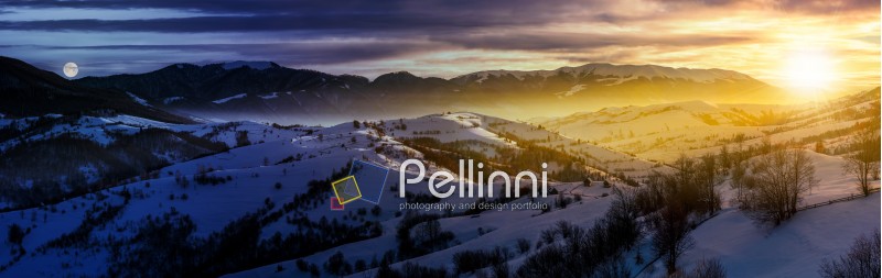 day and night time change concept in gorgeous panorama of mountainous countryside in winter. snow covered rural area on rolling hills and huge mountain ridge in a distance. fantasy world