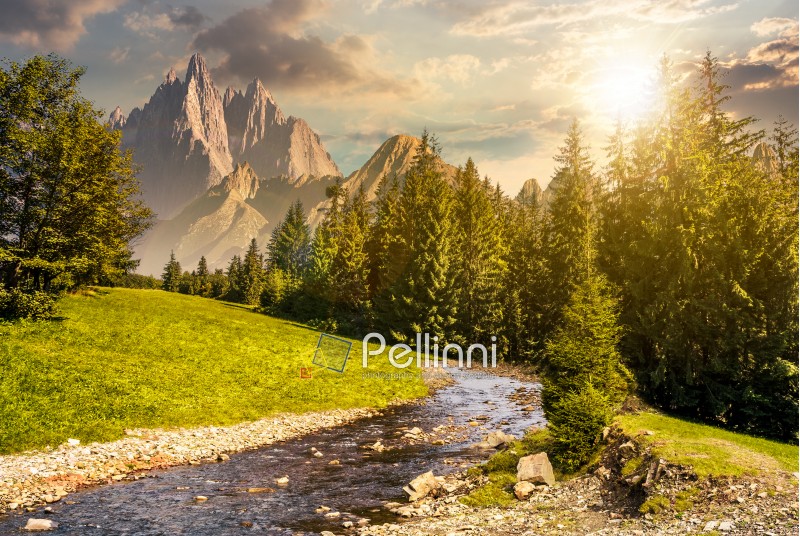 fairy tale mountainous summer landscape at sunset. composite image with high rocky peaks above the mountain river in spruce forest