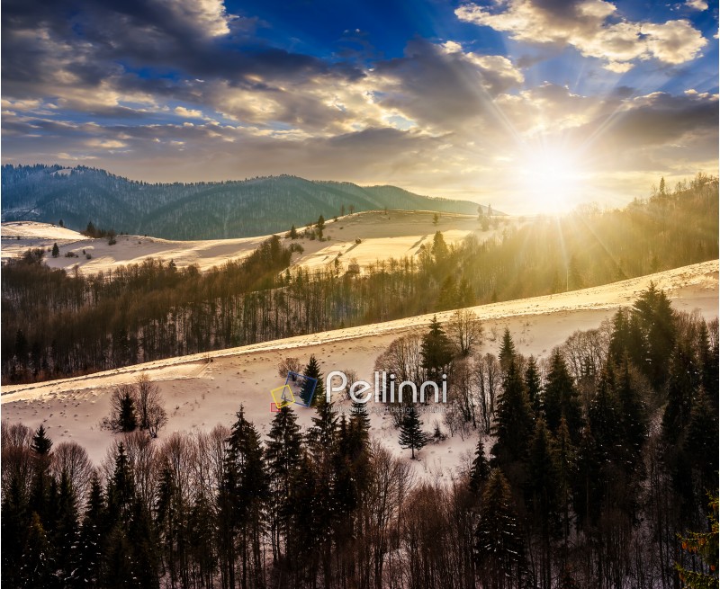 mountainous rural area of Carpathians in winter on fresh frosty  evening