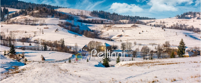 panorama of Carpatian village in winter. beautiful rural scenery in mountainous area