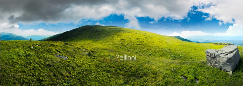 panorama with rock on the grassy hill in mountains. beautiful summer landscape. idyllic nature scenery. blue sky surrounded with clouds