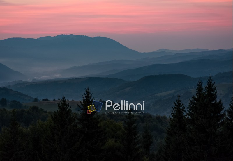 spectacular background of  landscape with reddish sky at dawn in mountains