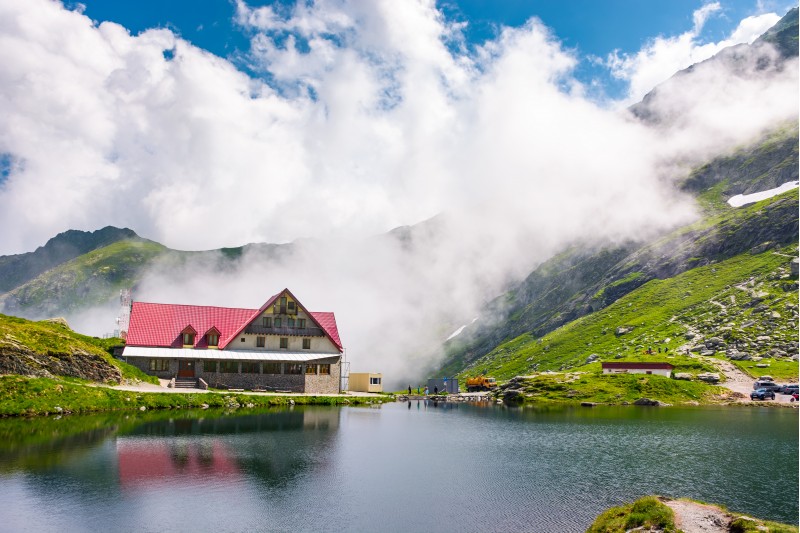 Fagaras mountains, Romania - Jun 26, 2017: rising clouds on lake Balea. beautiful summer landscape of popular tourist attraction. one of the most visited locations near the Tranfagarasan road