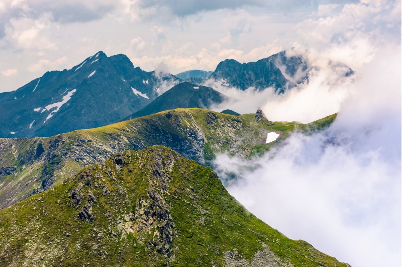 rising clouds over the Fagaras mountains of Romania. gorgeous nature scenery on high latitude in summertime