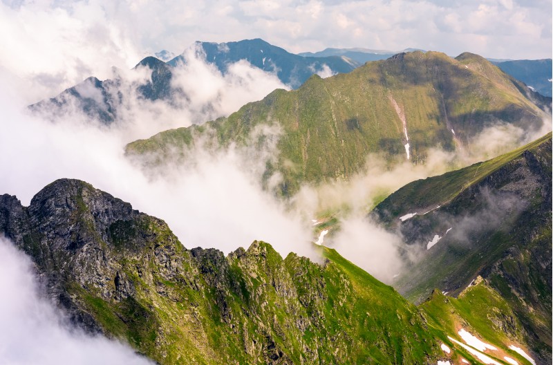 rising clouds over the Fagaras mountains of Romania. gorgeous nature scenery on high latitude in summertime