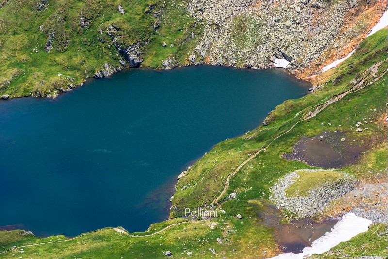 summer time in romanian carpathians. beautiful scenery of fagaras mountains. lake capra view from above
