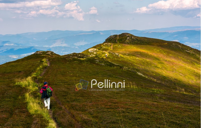 tourist on a foot path of mountain ridge. beautiful travel scenery