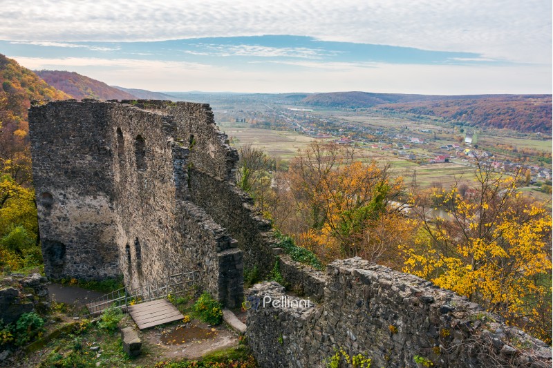 view from the wall of Nevytsky castle in to the valley with Kam'yanytsya village. wonderful autumn adventure