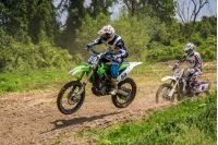 Uzhgorod, Ukraine - May 21, 2017: Extreme enduro MOTO SPORT. KTM racers turn on a corner in dirt. TransCarpathian regional Motocross Championship
