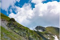 clouds over the mountain ridge with rocky cliffs. beautiful summer scenery of Fagaras mountains