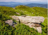 huge boulders on the edge of hillside. fine weather in summer mountain landscape