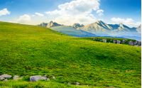 Hight Tatra mountain summer landscape. meadow with huge stones among the grass on top of the hillside near the peak of mountain range