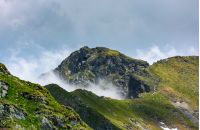 mountain peak over the cliff and clouds. beautiful summer scenery of Fagaras mountains
