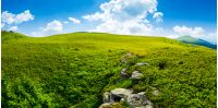 panorama of the hillside meadow. lovely summer landscape with boulders among the grass. location Runa mountain, Ukraine