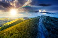 path uphill the mountain top. day and night time change concept. beautiful summer scenery with sun and moon at twilight. scenic landscape with rolling hills. harmony and progress calendar
