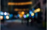 people moving on the old european city winter night street defocused blurred abstract image