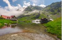 rising clouds on lake Balea. beautiful summer landscape of popular tourist attraction. one of the most visited locations near the Tranfagarasan road