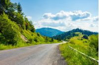 road through rural area in mountains. beautiful summer landscape. travel concept