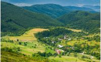 village in the valley. view from the top of a hill. beautiful summer scenery in mountains