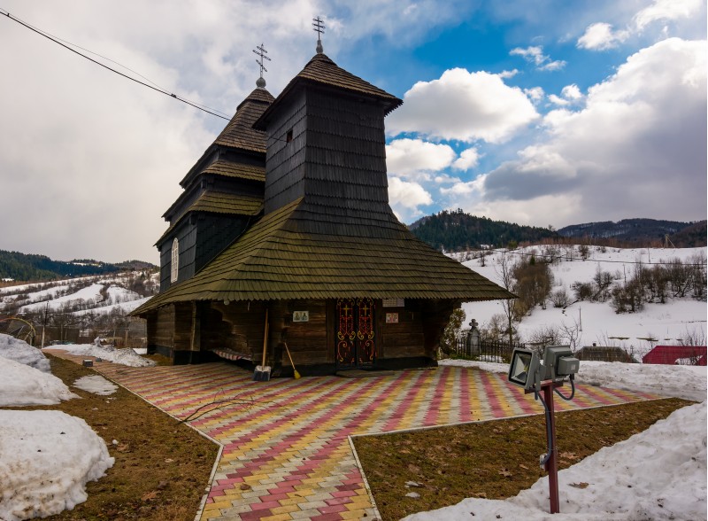 Uzhok, Ukraine - February 25, 2017: Church of the Archangel Michael - UNESCO World Heritage. old wooden building in Carpathian mountains in winter