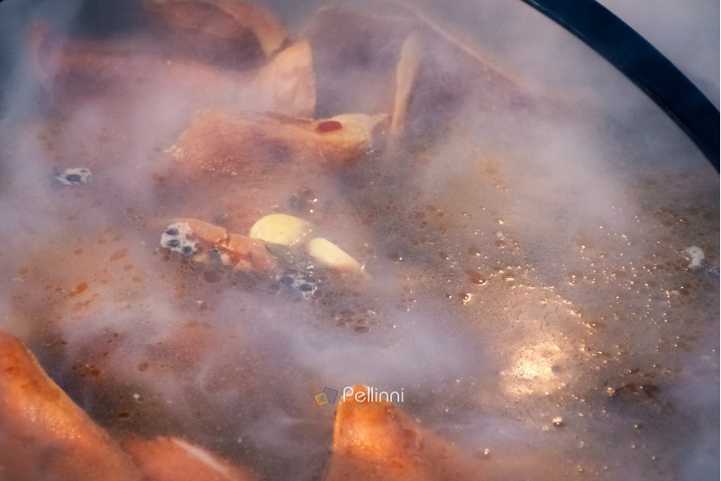 Hecha, Ukraine - JAN 27, 2018: Pork butchers competition. boiling meat in cauldron. food background