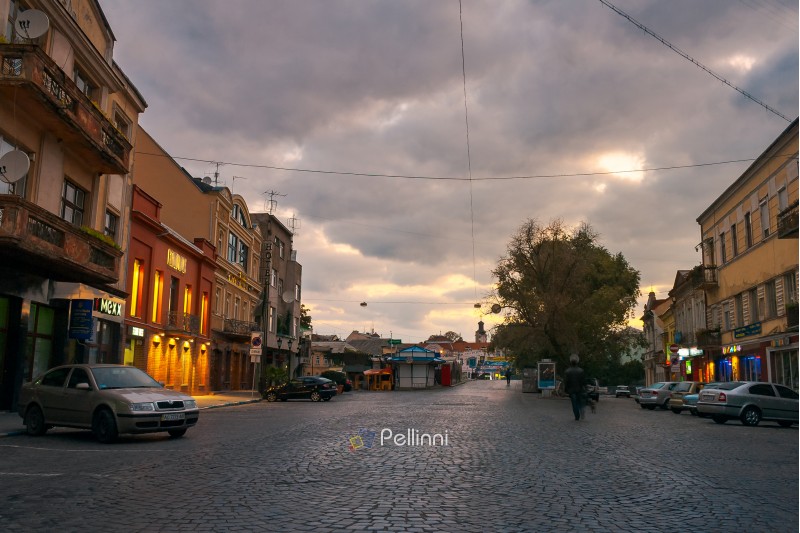 Uzhgorod, Ukraine - SEP 28, 2008: Petefi square on a cloudy autumn sunrise. old town awaiting for tourists crowds