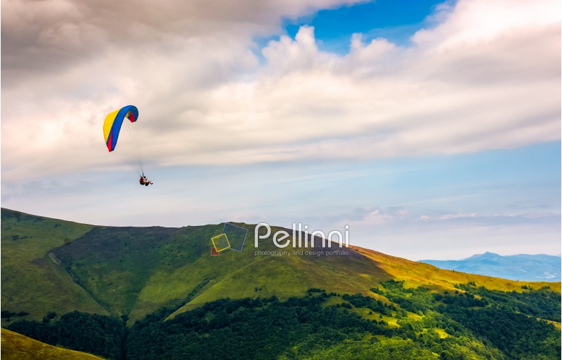Skydiving flying in the clouds over the mountains. parachute extreme sport