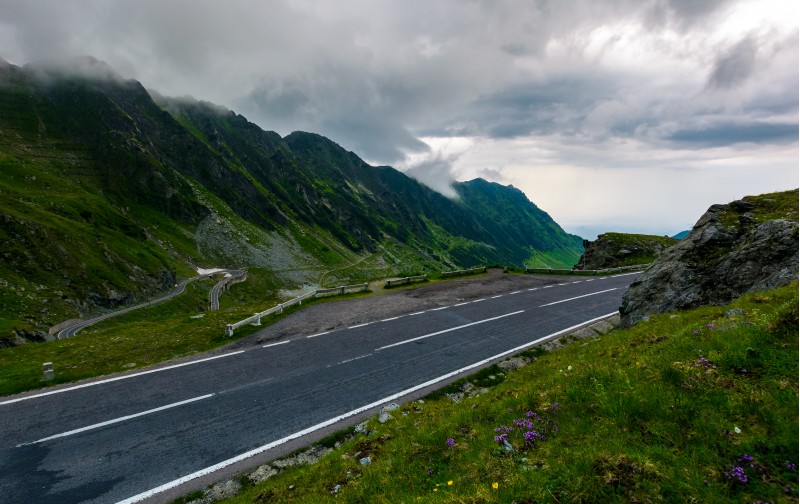 Transfagarasan road on a rainy day. dangerous driving concept. view from the side of the road