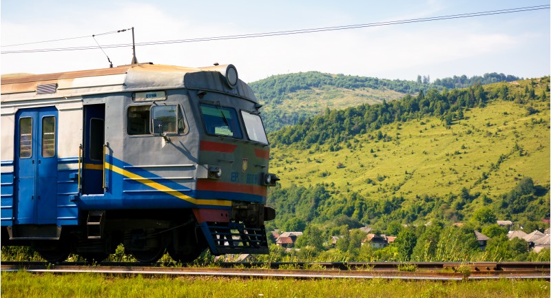 Huklyvyi, Ukraine - 20 Jul, 2017: ancient electric train arrival. moving fast in mountains