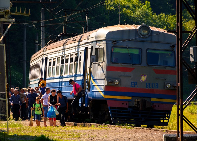 Huklyvyi, Ukraine - 20 Jul, 2017: ancient electric train arrival. people quickly take off