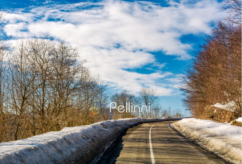 asphalt mountain road in winter. beautiful sunny day