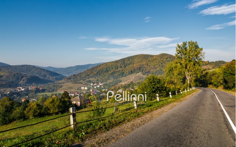 asphalt road in mountainous countryside. beautiful early autumn morning scenery