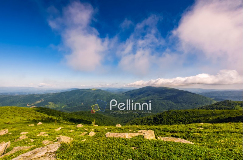 cloudy blue sky over the mountains with rocky hillside. gorgeous nature of Carpathian mountains
