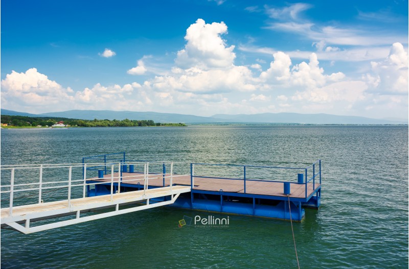 blue pier on Zemplinska Sirava lake. beautiful landscape of Slovakia with gorgeous cloudscape. Lovely place for vacation or weekend in summer