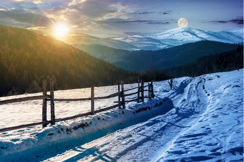time change concept. country road in to the winter mountains. wooden fence along the road. composite image