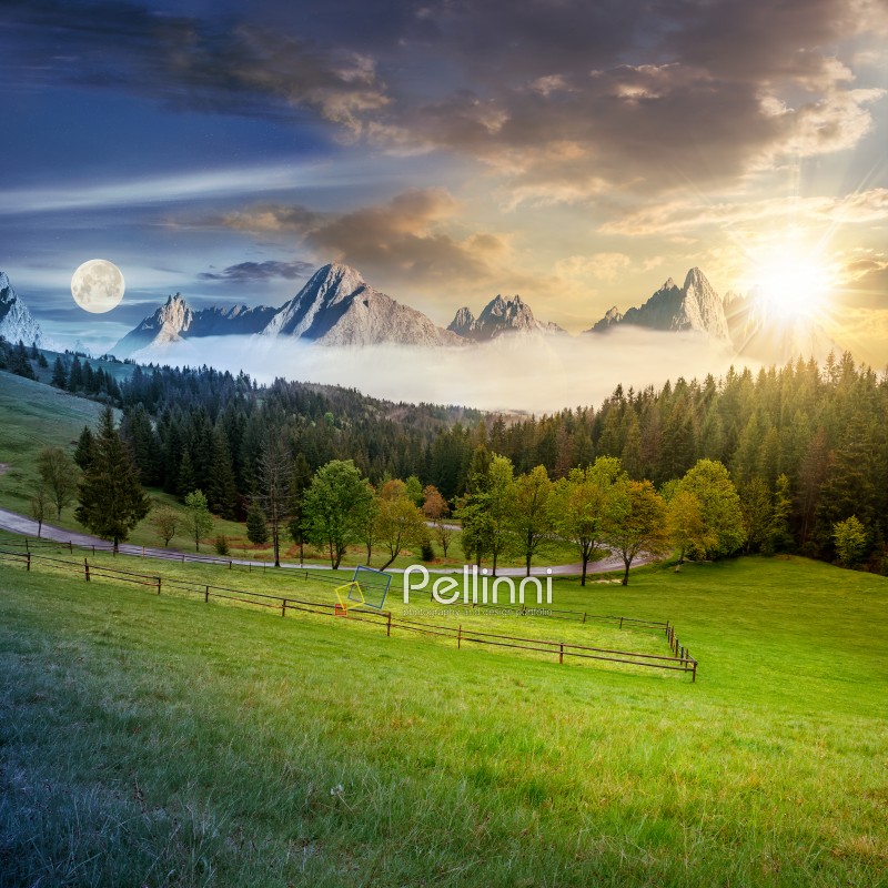 time concept of day and night change in composite summer mountain landscape. rural valley with fence on a  grassy meadow. curve road goes to the spruce forest in front of a huge ridge with rocky peaks
