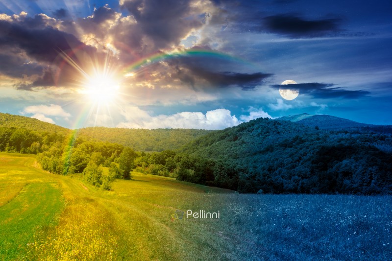 day meet night in beautiful countryside. epic view landscape in day meet night in beautiful countryside. epic view landscape in mountains on summer solstice. sun and moon in harmony over trail through the grassy field near forested rolling hills. rural scenery