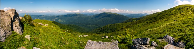 gorgeous panoramic landscape on Runa mountain. summer scenery in beautiful light. huge rocks on a grassy meadow