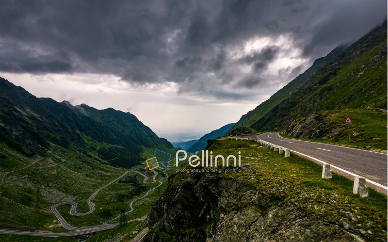 great Transfagarasan rout in stormy summer weather. great transport concept. gorgeous high altitude landscape on a rainy day. winding serpentine in Southern Carpathian Fagaras Mountains of Romania