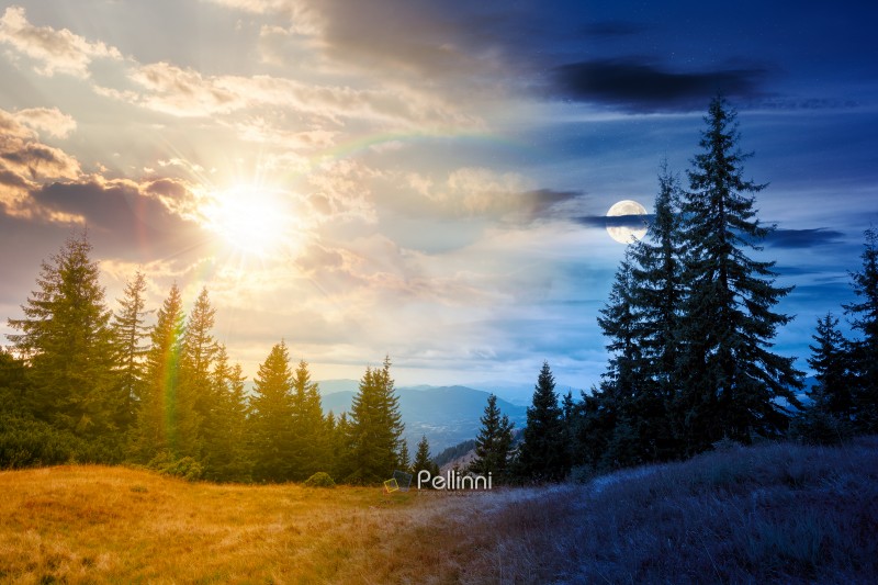 hill with coniferous forest on a meadow in mountains of Ukraine. hill with coniferous forest on a meadow in mountains of Ukraine. day meet night. sun and moon over Synevyr national park landscape, Transcrpathia on autumn equinox. spruce trees under epic sky