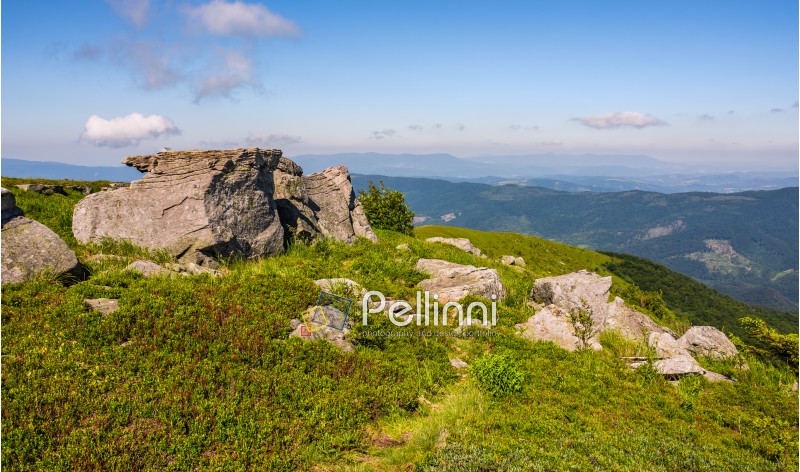huge rocks on the edge of hillside. fine weather in summer mountain landscape. beautiful nature background