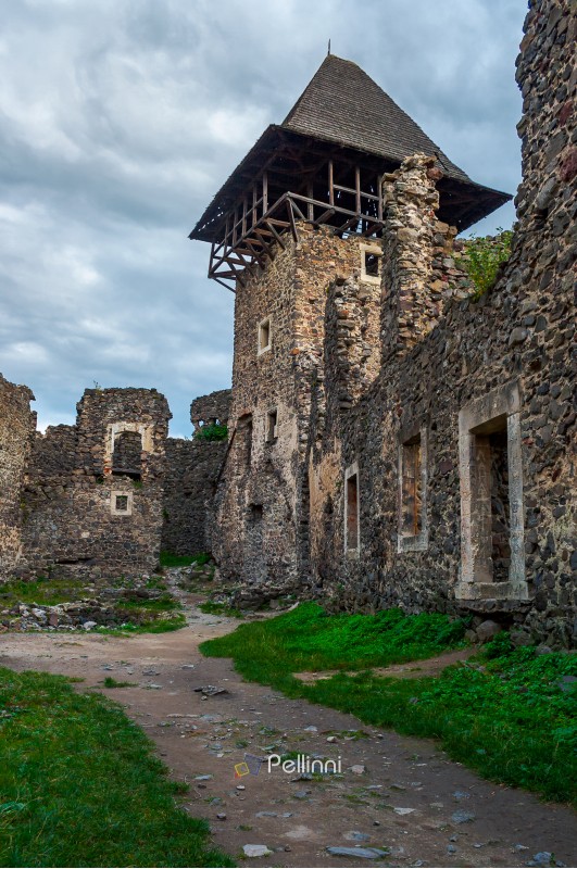 inner yard and tower of Nevytsky castle. ruins of medieval fortress, popular tourist destination of TransCarpathia