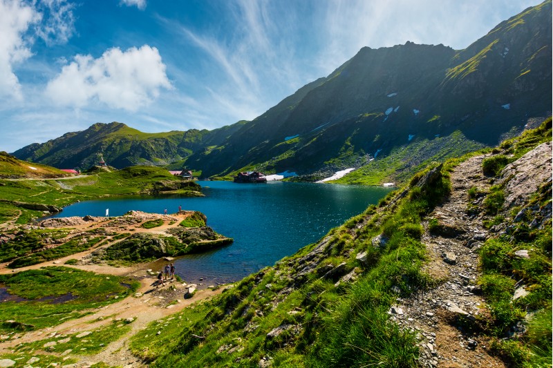 lake Balea in Fagaras mountains on a bright sunny day. amazing summer landscape of one of the most visited landmarks in Romania