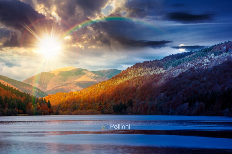 landscape with lake in autumn. day meet night. sun and moon over scenic view of forest reflection on the lake surface at twilight. rika river water reserve. transcarpathia in fall season. astrology wallpaper
