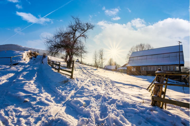 lovely winter scenery of Carpathian village. lots of snow on a sunny day in mountainous area