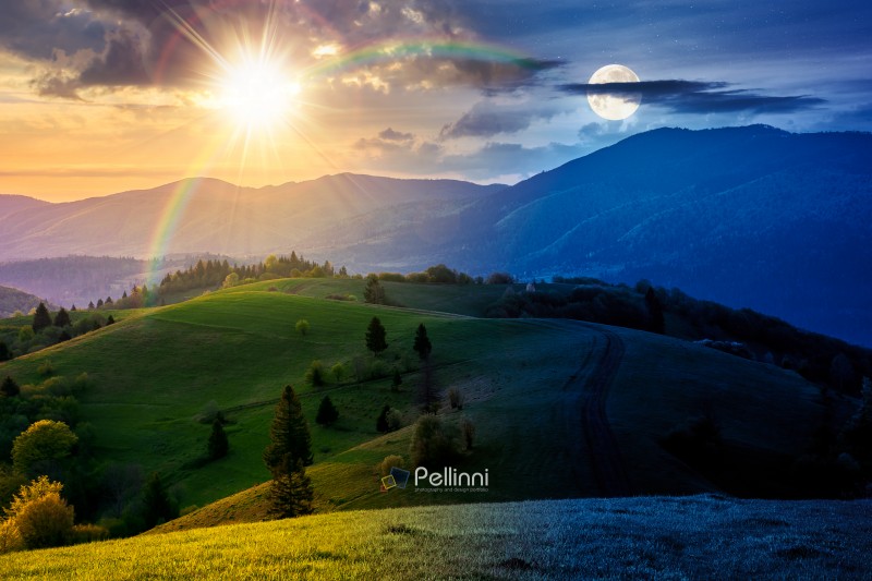 mountainous countryside scenery in springtime. day and night time change concept. dirt road and trees on the rolling hills under sun and moon. mountain ridge in the distance. alpine rural landscape